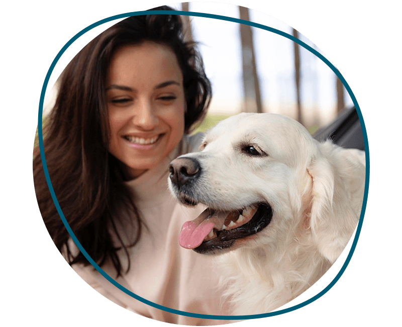 woman holding happy dog