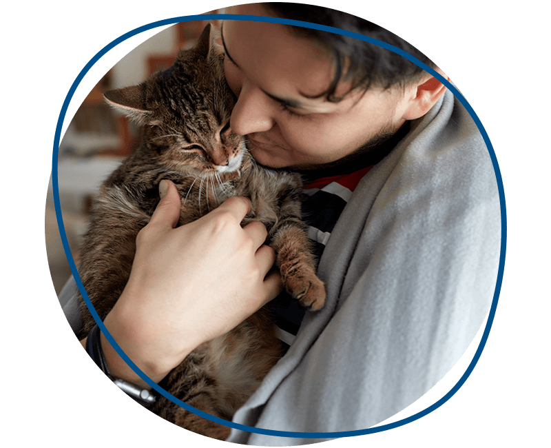 young man t shirt holding cat